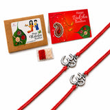 Red braided rakhi with silver om charm, traditional handmade bracelet for brother and bhabhi with roli chawal and greeting card