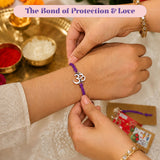 Purple cord bracelet with silver om symbol charm from designer om rakhi set for brother and bhabhi protection gift