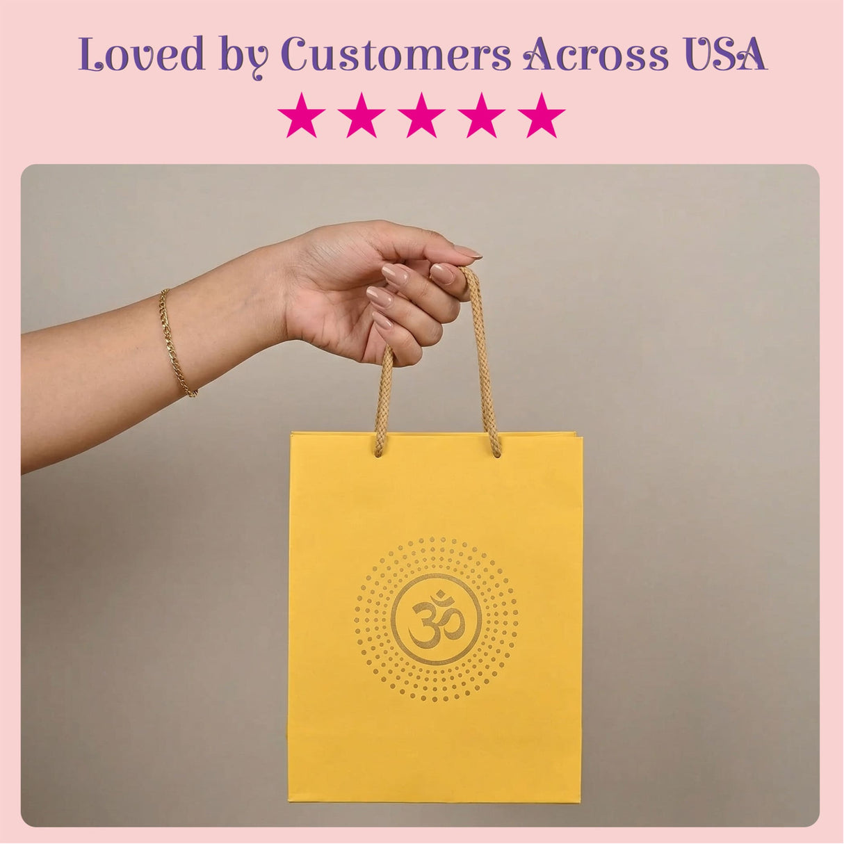 Yellow paper gift bag with gold handles and embossed om symbol eco-friendly indian gift bag for wedding puja and diwali gifts