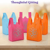 Brightly colored pink and orange lightweight non woven fabric gift bags with silver om print for Indian wedding favors