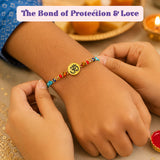 Religious Om Rakhi Hamper for Brother - Includes 2 Colorful Adjustable Bracelet Threads, Chocolate, Haldi Kumkum Holder, Thandai, Roli Chawal & Gift Box