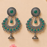 Indian oxidized silver floral chandbali earrings with vibrant green jade stones and intricate filigree for ethnic wear
