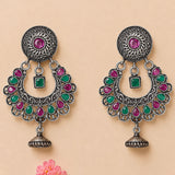 Indian oxidized floral chandbali earrings with silver filigree, pink and green gemstones, bell detail for ethnic wear
