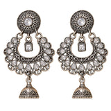Silver-toned oxidized floral chandbali jhumka earrings with intricate filigree clear crystals and bell pendant for ethnic wear