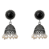 Silver oxidized floral jhumka earrings with black onyx stones and dangling faux pearl beads for traditional wear
