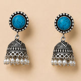 Silver oxidized floral jhumka earrings with turquoise stones diamonds and faux pearls for traditional wedding wear