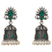 Silver oxidized floral jhumka earrings with intricate filigree, emerald teardrop stones, and faux pearl accents for ethnic wear