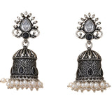 Silver and black ornate oxidized floral jhumka earrings with teardrop stone and faux pearls for diwali and ethnic wear