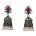 Indian oxidized silver jhumka earrings with intricate filigree pink and green gemstones and white faux pearl dangles
