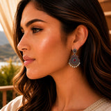 Indian oxidized silver filigree chandbali earrings with a red gemstone and faux pearl dangles for ethnic wear and weddings