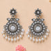 Silver oxidized chandbali earrings with intricate floral design clear crystals and dangling white faux pearls for ethnic wear