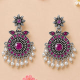 Elegant silver-toned Indian oxidized chandbali earrings with deep pink gemstones and dangled white faux pearls for ethnic wear