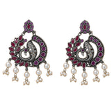 Silver peacock chandbali earrings with red and purple gemstones and pearl dangles for traditional Indian wear