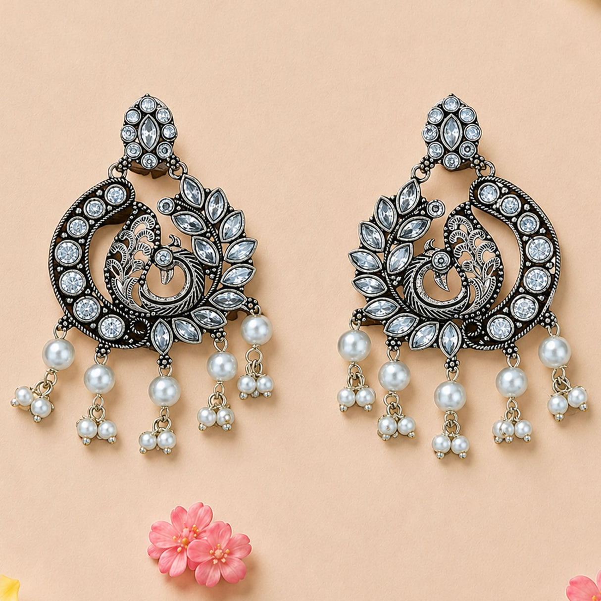 Elegant black metal boho peacock oxidized chandbali earrings with clear crystals and white pearl dangles for ethnic wear
