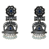 Silver oxidized floral elephant jhumka earrings with deep blue gemstones and faux pearl beads for traditional wear