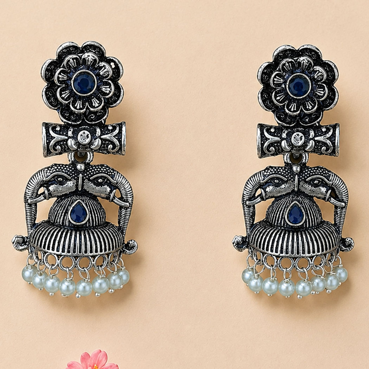Silver oxidized elephant-themed jhumka earrings with deep blue gemstones floral and beaded designs for ethnic wear