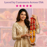 Vibrant red yellow floral varmala garland in womans hands for wedding