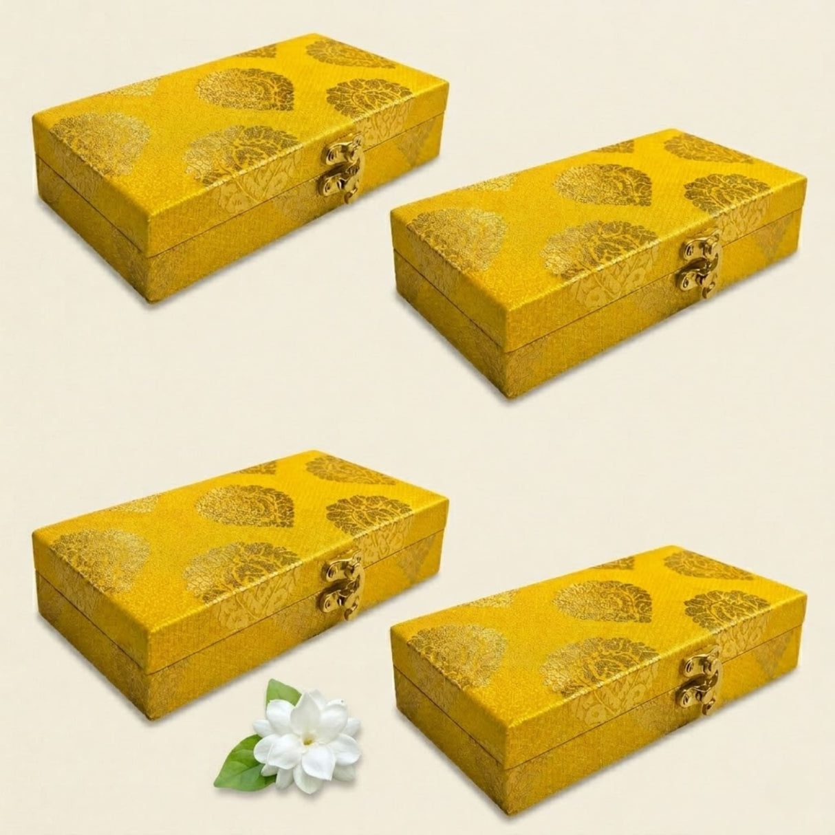 Golden rectangular brocade jewelry organizer boxes with intricate floral patterns and metallic clasps for wedding favors