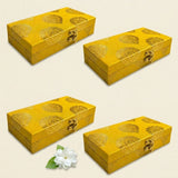 Golden rectangular brocade jewelry organizer boxes with intricate floral patterns and metallic clasps for wedding favors