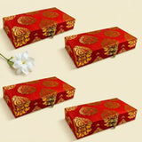 Red rectangular brocade jewelry organizer boxes with gold paisley patterns and metallic clasps for wedding favors