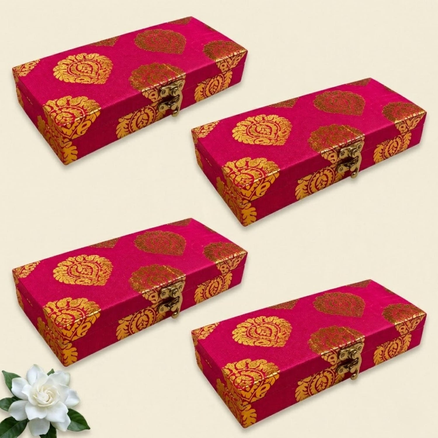 Four vibrant fuchsia brocade jewelry organizer boxes with gold and red patterns and metallic clasps for wedding favors
