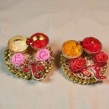 Golden and pink rose-adorned decorative candle holders from Pack of 4 Ganesha Pooja gift set