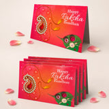 Vibrant red rakhi greeting card with intricate gold and silver paisley embellishments for brother and sister gift pack
