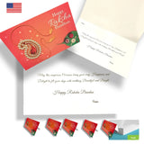 Red glossy rakhi greeting card with gold and red ornate paisley design and embedded gemstones for brother sister gift