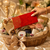 A red velvet money envelope with intricate gold paisley embroidery for Indian wedding cash gifts and savings