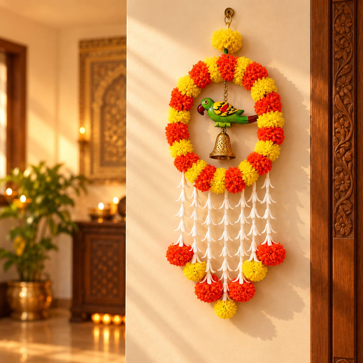A vibrant red and yellow artificial marigold hanging jhoomer garland with a green parrot figurine and brass bell for festive decor