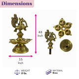 Golden brass diya with intricate peacock design and five oil cups for diwali puja and indian home decor