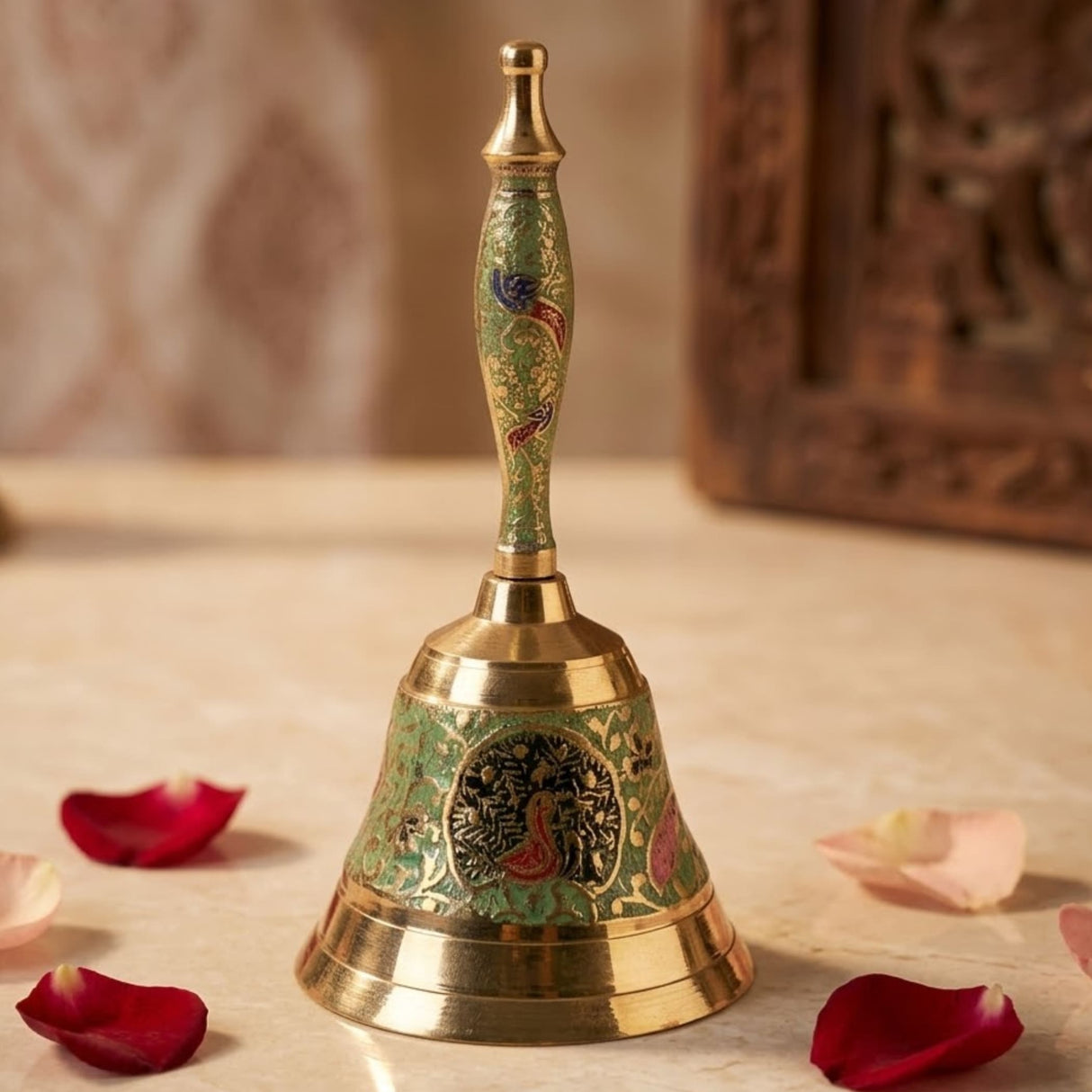 Decorative peacock temple bell handcrafted in brass with green enamel and gold-toned floral and peacock designs