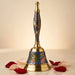 Decorative peacock temple brass bell with intricate blue and gold floral enamel designs for Hindu puja use