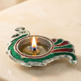 Peacock deepam brass finish diya with silver base and green red enamel accents for diwali puja and home decor