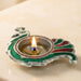 Peacock deepam brass finish diya with silver base and green red enamel accents for diwali puja and home decor