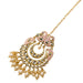 Peacock maang tikka with gold plating featuring intricate paisley designs pink enamel sparkling stones and cream pearls