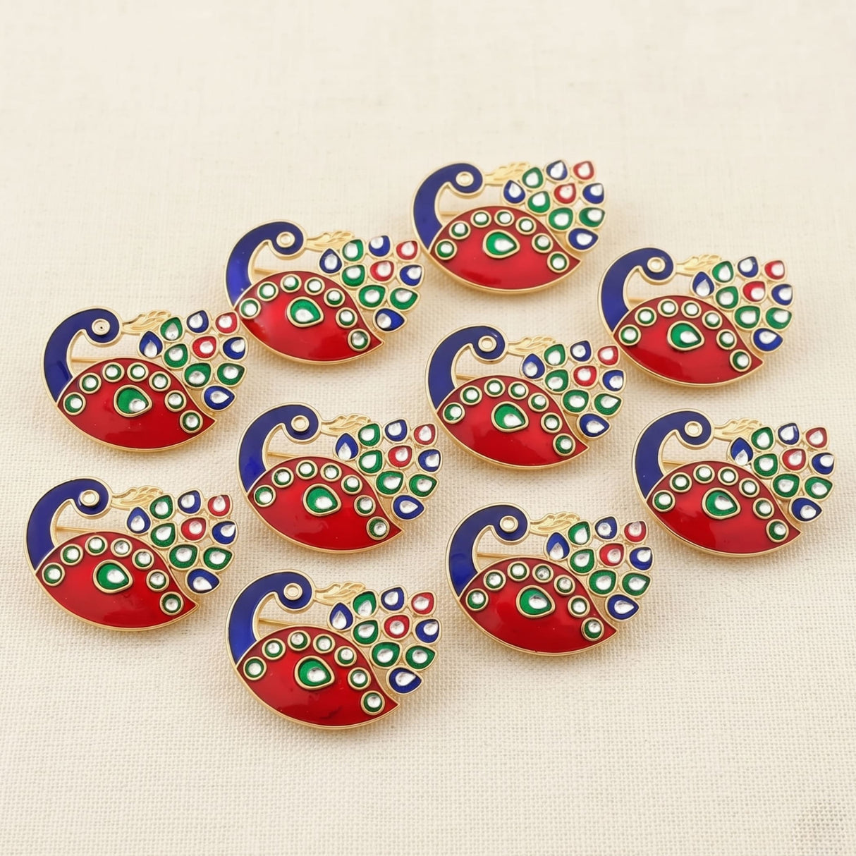 Decorative bulk peacock haldi kumkum holder with vibrant red green blue enamel and gold tone metal edges for diwali pooja