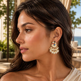 Indian peacock chandbali gold tone earrings with blue gemstone, intricate enamel, and cascading white faux pearls for weddings
