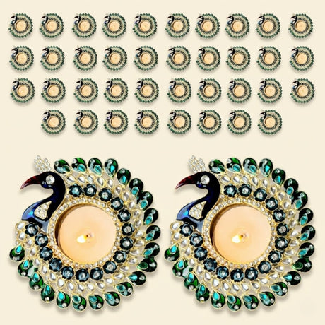 Peacock tealight candle holder with tealight holders adorned with green and blue gemstones and gold-toned metalwork