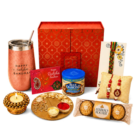 Copper-colored insulated tumbler with silver lid and happy raksha bandhan engraving in traditional gift hamper set