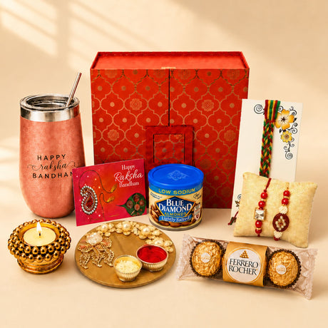 Red patterned gift box with gold floral design in raksha bandhan gift hamper set for brother and bhabhi