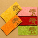 Set of five colorful decorative money envelopes with embossed golden peacock tree design for Indian wedding and gift use