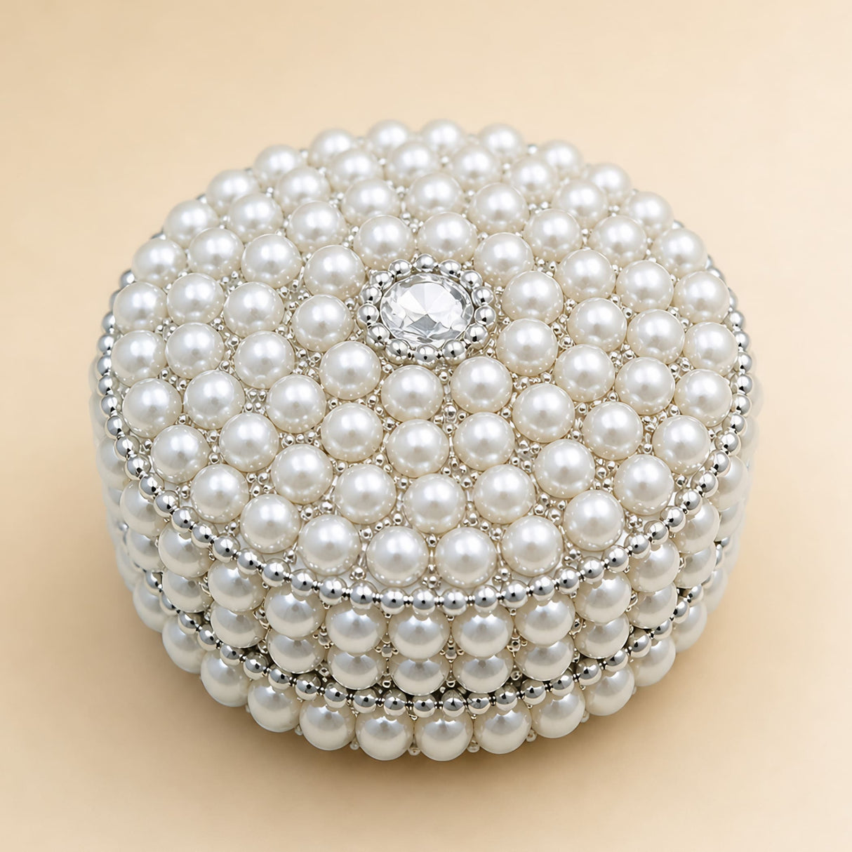 Pearl jewelry box for women and girls with round pearl encrusted design, diamond accent, and silver metallic detailing