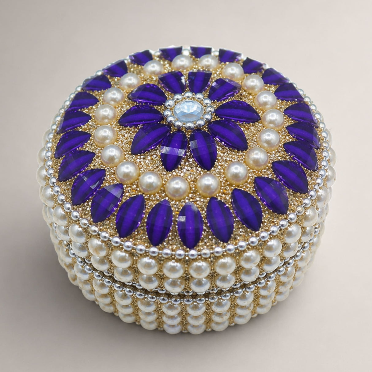 Pearl jewelry box for women adorned with purple stones cream pearls and a blue gemstone for travel and gifts