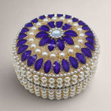 Pearl jewelry box for women adorned with purple stones cream pearls and a blue gemstone for travel and gifts