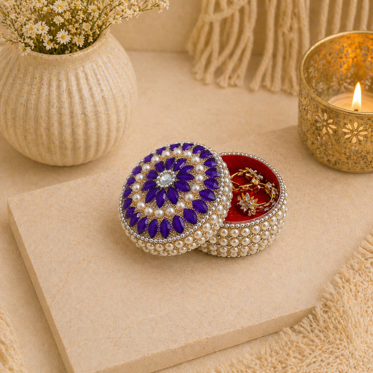 A round pearl jewelry box for women with a purple and white beaded floral lid adorned with pearls and rhinestones ideal for travel and gifting