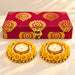 A pair of ornate yellow rose adorned tealight holders with gold accents and pearls for Diwali and home decor gifts