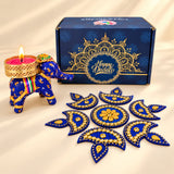 Blue elephant-shaped diya with gold detailing and a lit pink candle for personalize Diwali gifts box and corporate gifting