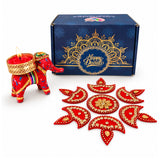 Red elephant-shaped candle holder with gold accents and woven golden rim for Diwali corporate gifting hamper box