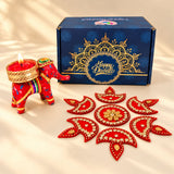 Red elephant-shaped candle holder with gold and colorful decorative accents for diwali and corporate gifting